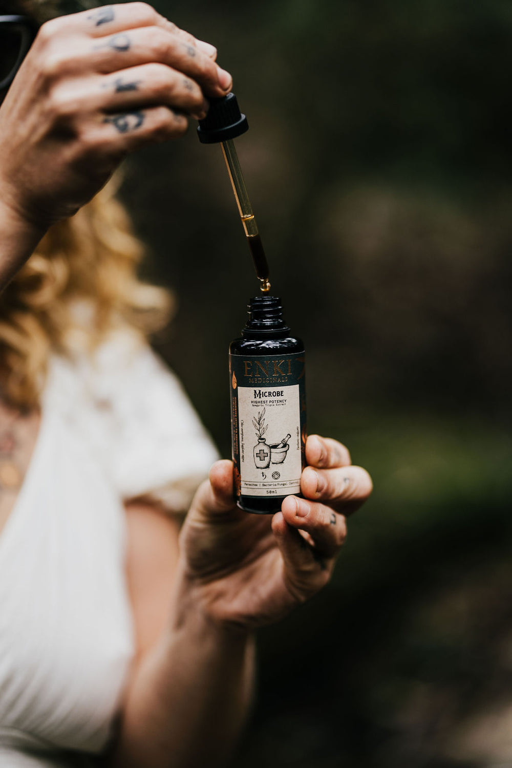 Antibacterial herbal extract in glass dropper